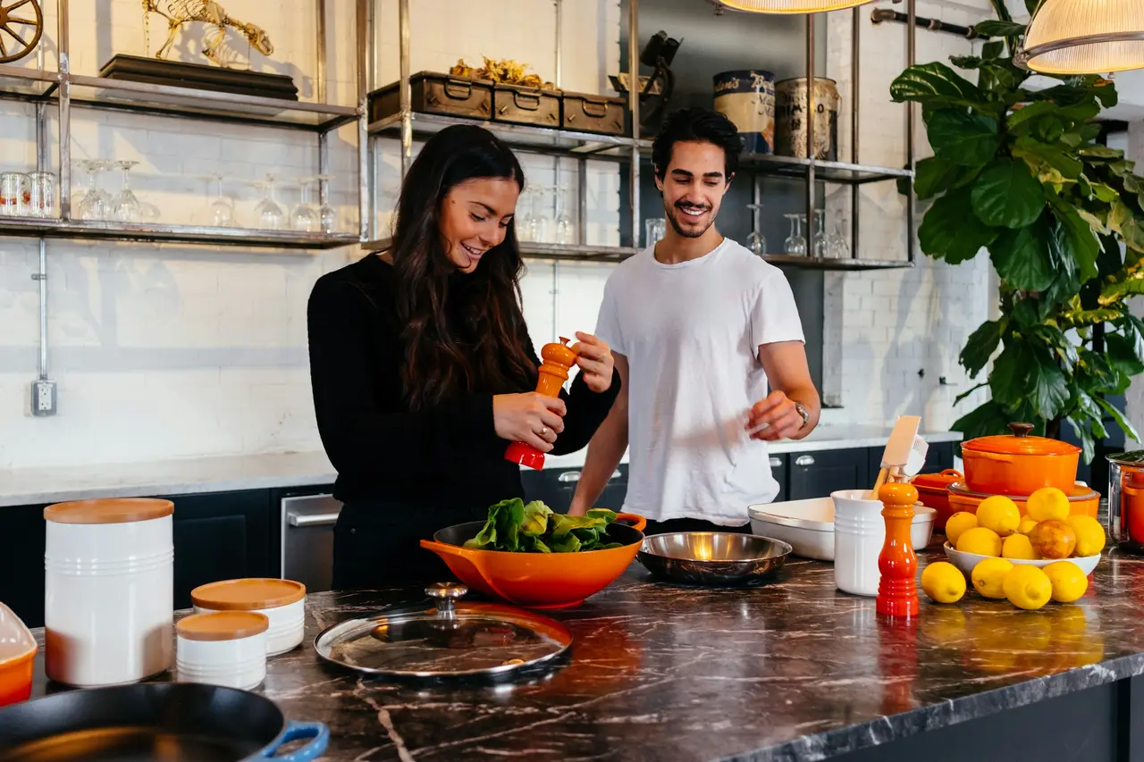 A couple preparing a fresh meal together in a home kitchen